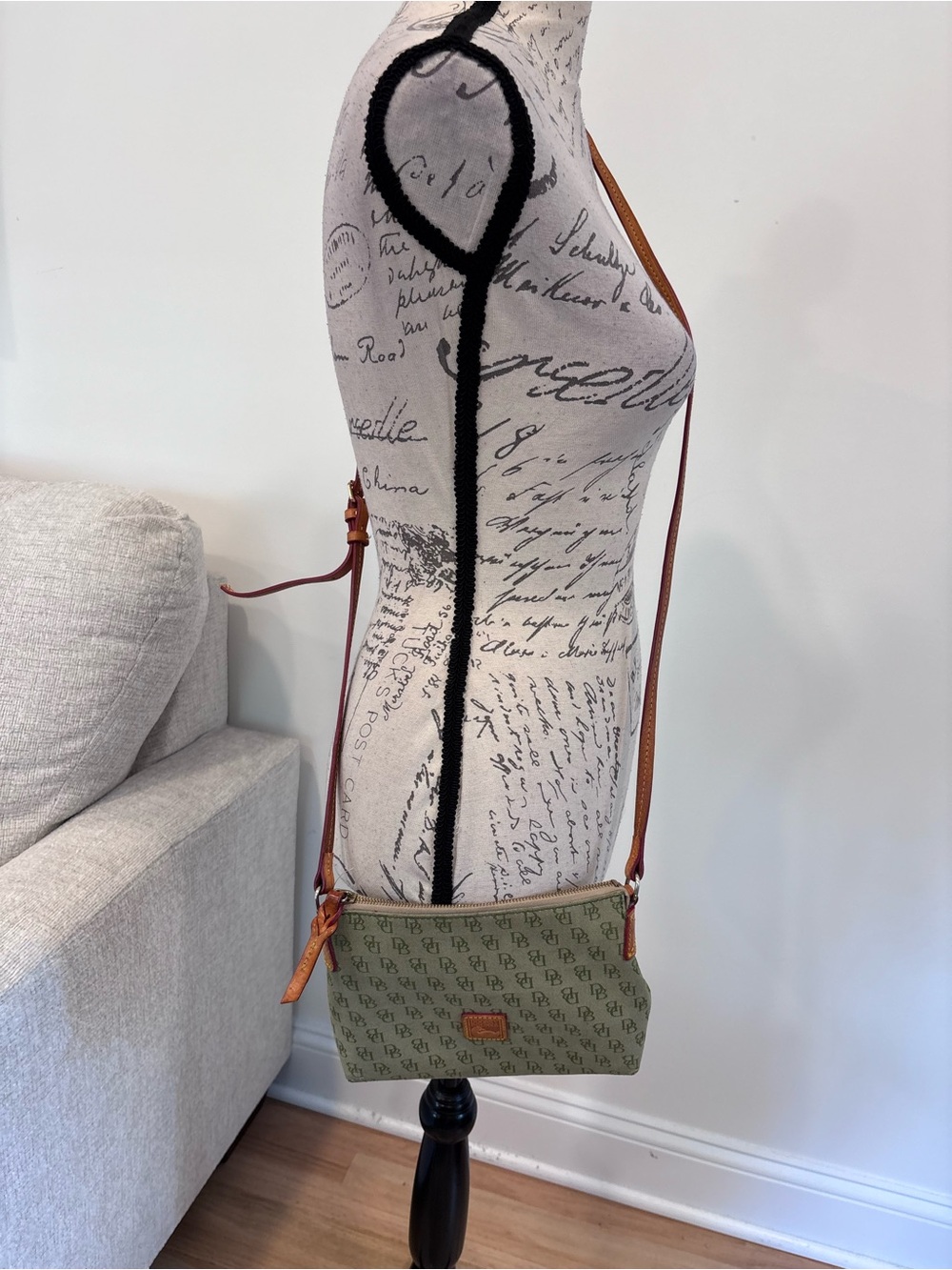 Dooney & Bourke green monogram canvas crossbody bag with brown leather trim